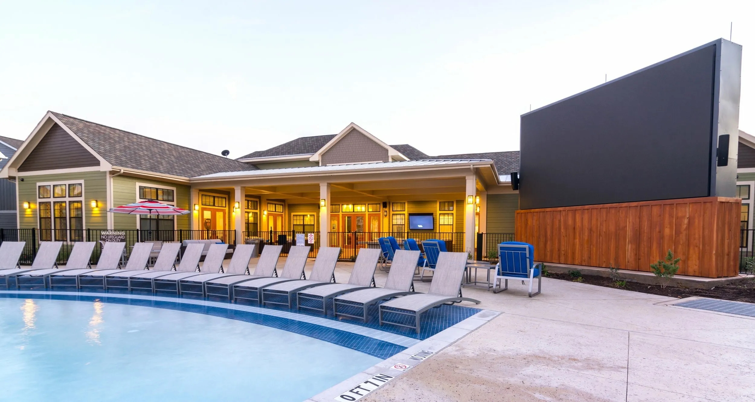 Relax by the pool in the comfortable seating, perfect for downtime or catching up with friends.